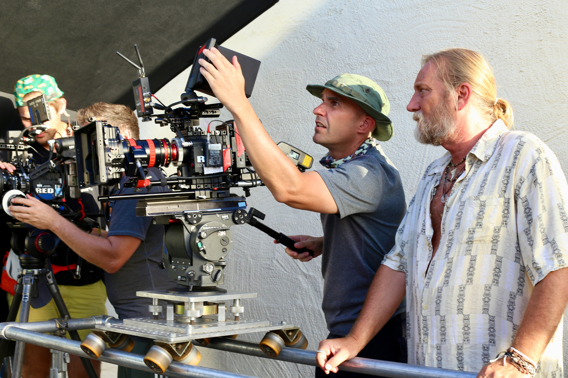 Director framing a shot with the camera crew